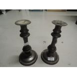 A pair of vintage candle sticks