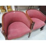 A pair of reproduction tub chairs