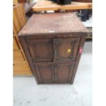 A vintage dark oak cupboard set