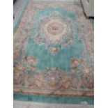 A modern carpet square with floral pattern approx 9ft x 6ft