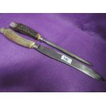 A vintage carving knife and sharpener by Mappin & Webb having antler handles with HM silver