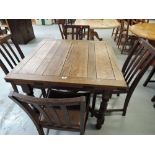 A vintage extendable kitchen table and four chair set in oak