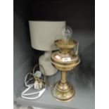 A modern table lamp and a converted oil lamp