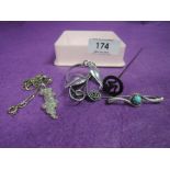 Four pieces of HM silver and white metal stamped silver including hat pin, brooches, pendant etc