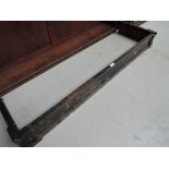 A vintage cast iron fire surround