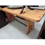 A heavy set pine dining table with worn patina