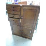 A vintage set of specimen style drawers and cupboard set with glass liners