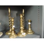 A selection of vintage brass cast candle sticks