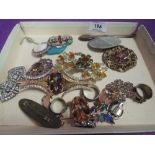 A selection of costume jewellery including insect brooch, acrylic ring, diamante brooches, etc