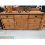 A vintage deal wood farmhouse style sideboard with aged patina