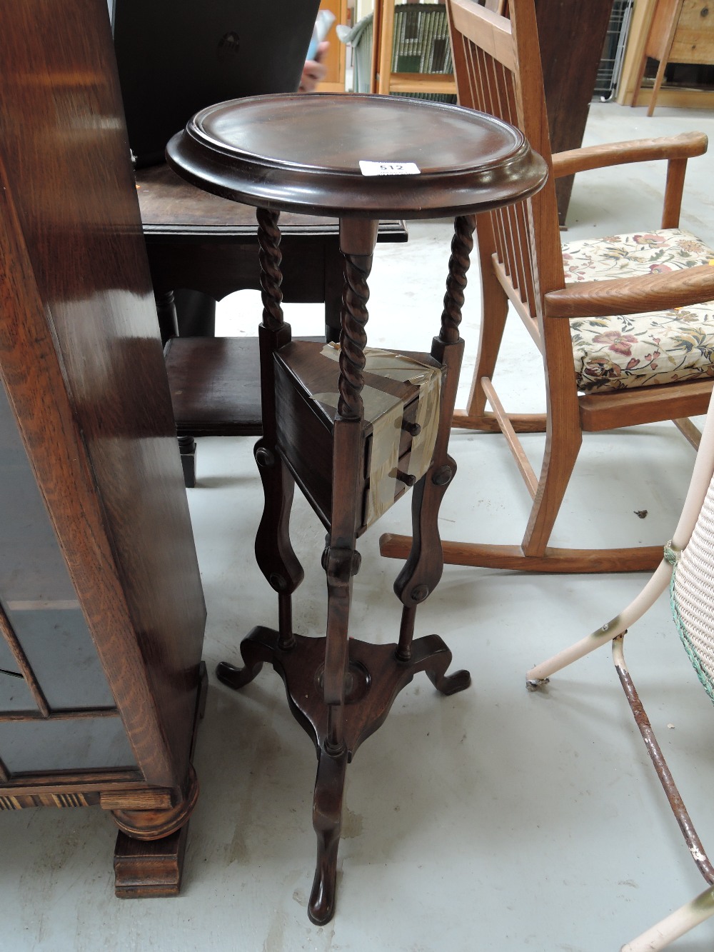 A reproduction plant stand with integral draws and twist stems