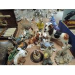 A selection of vintage figures and figurines including golfing dog