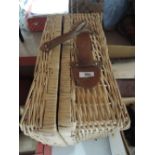 A vintage wicker woven picnic basket