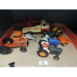 Three Britains diecast tractors, a Lone star diecast tractor, a similar diecast Massey Ferguson