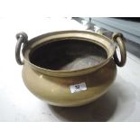 A large heavy brass cast cauldron style planter