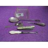 A small selection of HM silver and white metal including manicure tools, stylised spoon etc