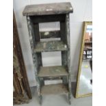 A set of vintage decorators step ladders