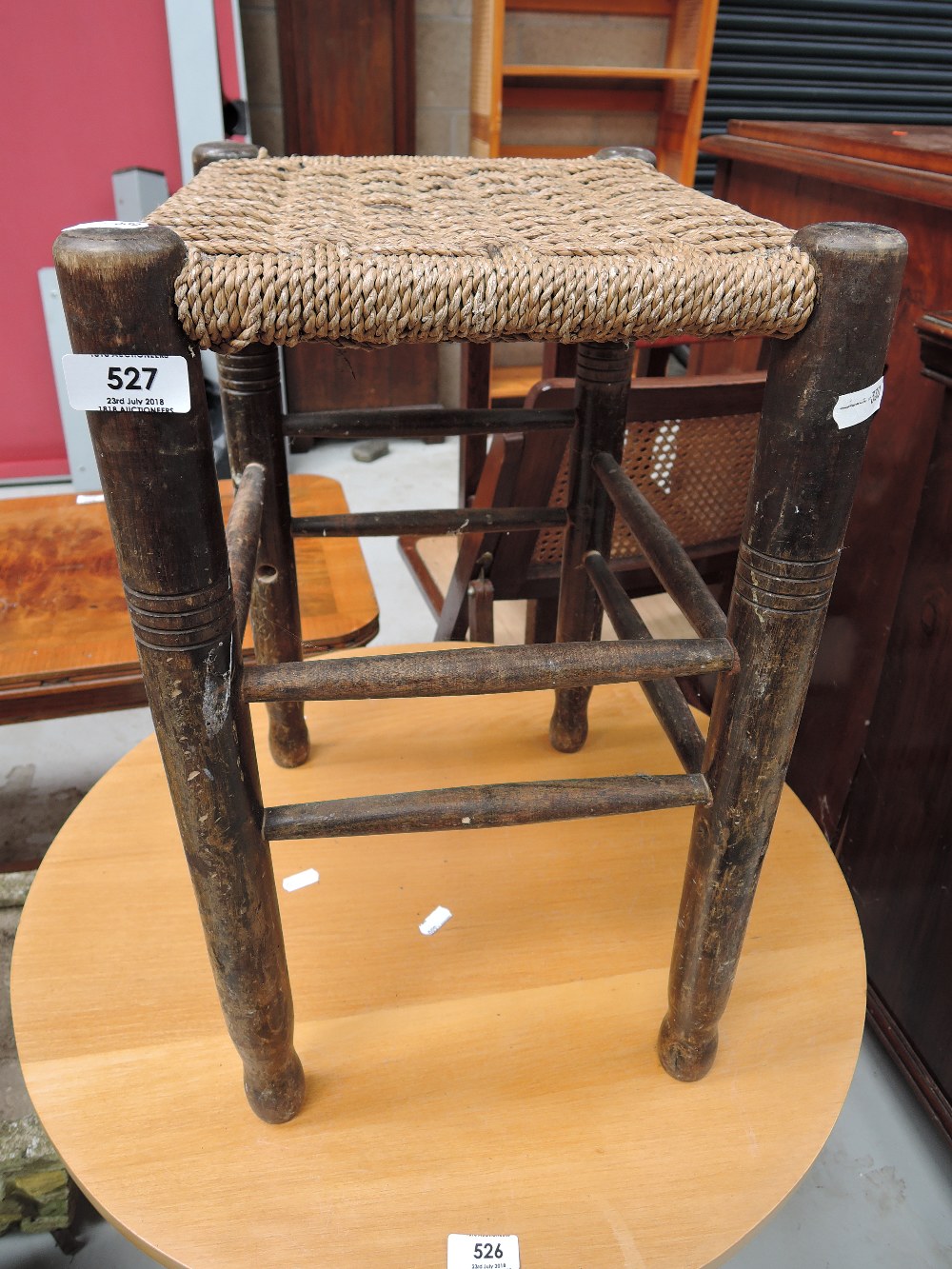 A woven fibre seated stool