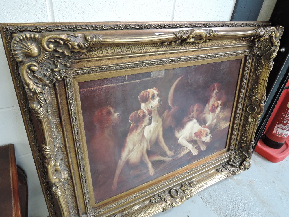 A large modern print of hounds, in gilt frame