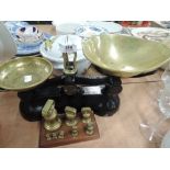 A vintage scale and set of graduated brass weights