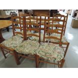 A set of six ladder back pine chairs