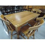 A modern dining table and chair set in beech and pine with rustic country style
