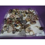 A selection of costume jewellery earrings and rings including diamante, enamelled etc