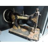 A vintage Liddell and sons hand cranked sewing machine with printed body