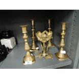 A selection of vintage brass cast candle sticks