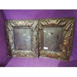 A pair of vintage arts and crafts design photo frames with copper pressed design