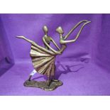 A vintage metal cast dancing ballerina in a Degas style