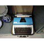 A vintage Lilliput typewriter with case