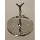 A silver ring stand of circular form having central moulded branch, Chester 1923, J & R Griffin