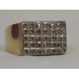 A gents yellow metal signet ring stamped 585 having a diamond chip set rectangular panel, size W