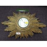 An early 20th century French gilt wood 8 day wall clock of sunburst design