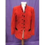 A red suede jacket by Mario Hernandez having black trim and buttons, size 10
