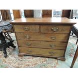 A late Victorian mahogany chest of 2 short and 3 long drawers by Arthur W Simpson in the Georgian