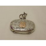 A silver double sovereign holder having engraved foliate decoration and 9ct gold monogrammed