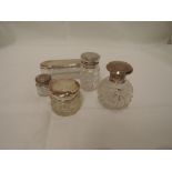 Five cut and plain glass dressing table pots having HM silver and white metal lids