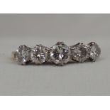 A lady's dress ring having five graduated diamonds, total approx 1.25ct in a raised claw mount on