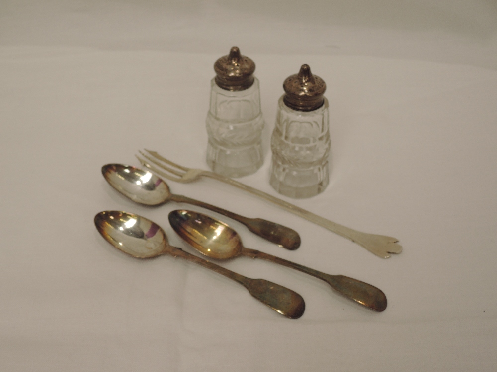 A selection of HM silver including three Georgian teaspoons, a pair of cut glass pepperettes