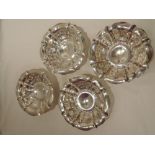 A set of four Edwardian silver bon bon dishes having frilled decoration on pedestal foot,