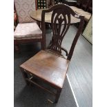 A late 18th/early 19th century elm vernacular chair having camel back, with solid seat and square