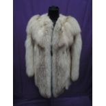 A lady's silver fox fur collarless short jacket retailed by Gladys Whitaker of Blackpool