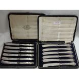 Two cased sets of HM silver handled butter knives