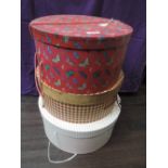 Three decorative hat boxes containing a selection of lady's hats including vintage