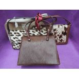Four lady's vintage animal skin/fur handbags including East African, cow hide and Interwainer