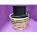 A gents black top hat with leather and silk lining in a vintage Christys' Wildfowl hat box, inner