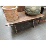 A late 20th century oak period style coffee table on X frame