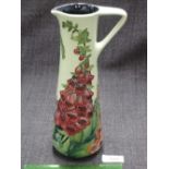 A Moorcroft jug in the Amberwood Foxglove pattern designed by Rachel Bishop 2002, number 66,